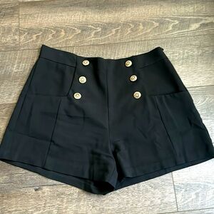 Black with gold buttons, trouser shorts